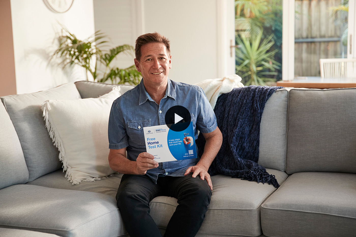 Laurie holding the free home test kit